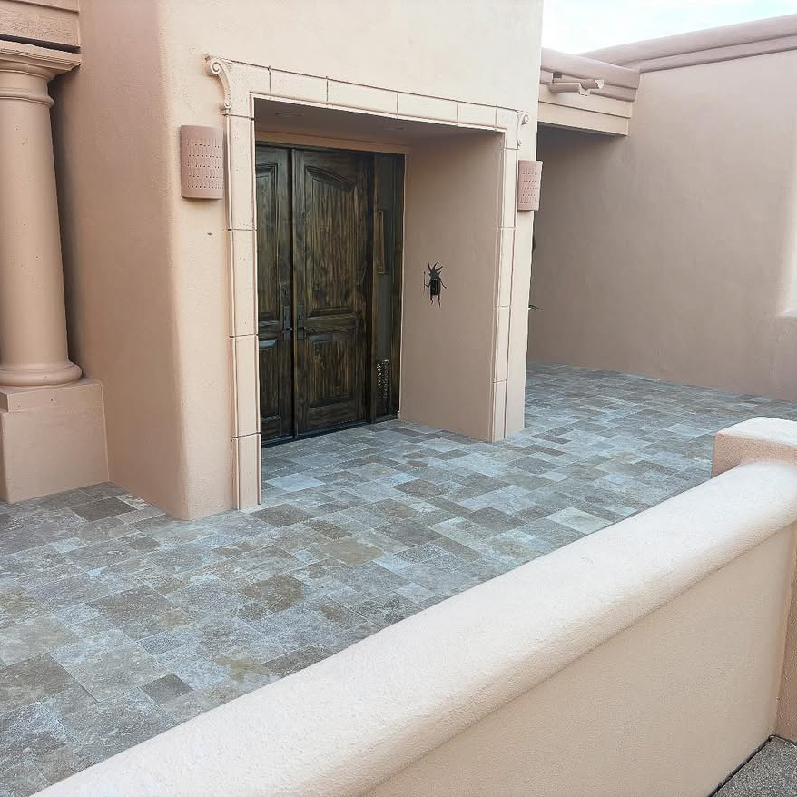 Courtyard wrapped in Noce travertine
